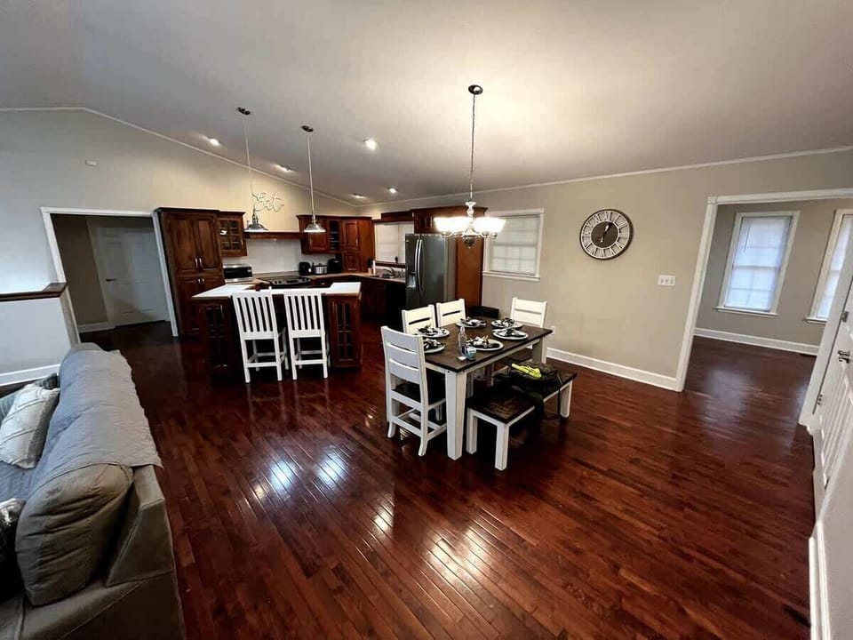 Bright and inviting space for family feasts and laughter under elegant lighting!