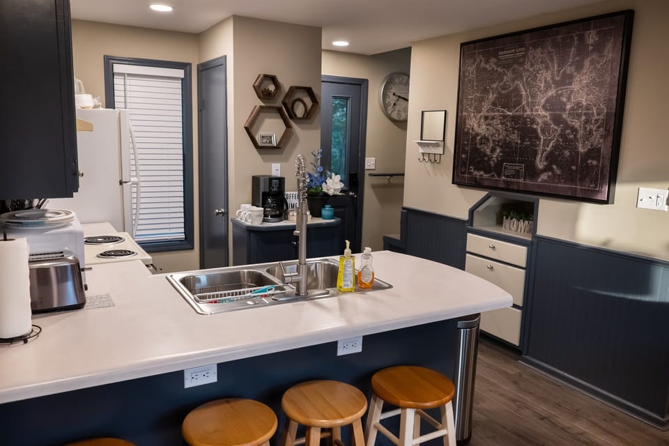 Full kitchen and stools for the bar
