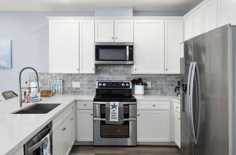 Electric stove top oven, microwave, dishwasher, and refrigerator