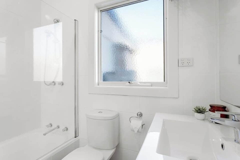 The bathroom, with large bath