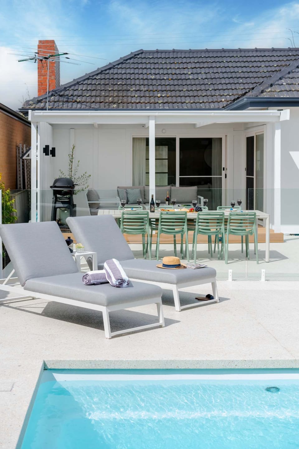 Outlook toward the modern, undercover pergola and BBQ space