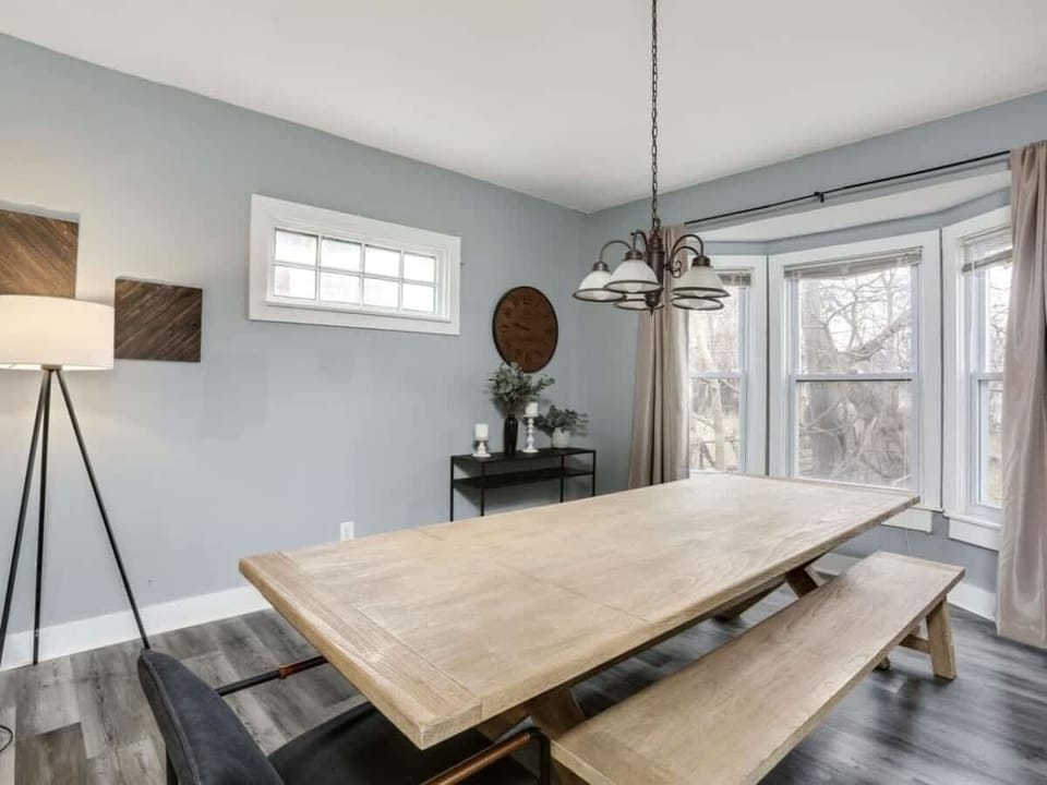 Bright dining area with large windows and seating for the whole group.