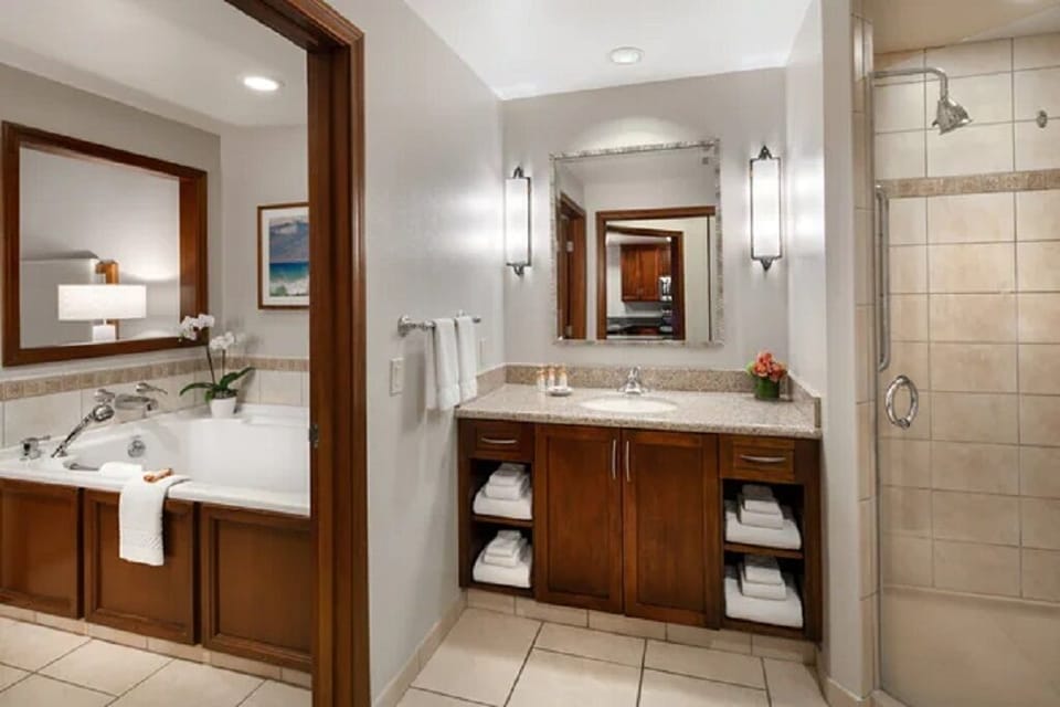 Master shower area with Jacuzzi tub and another small area(Not shown) for makeup