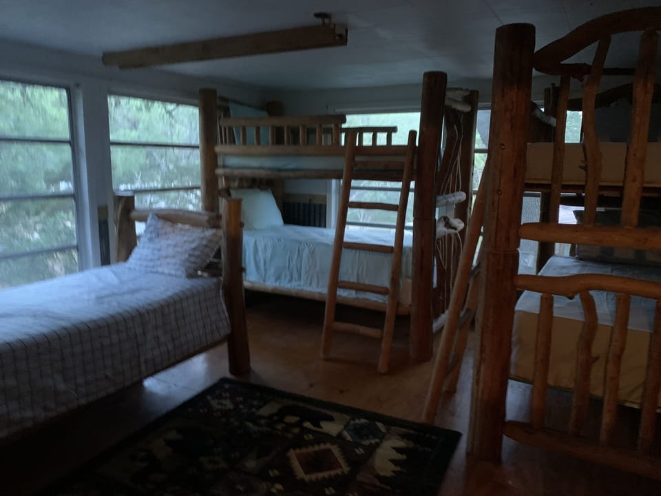 5 of 7 twin bunks in log bunk room
