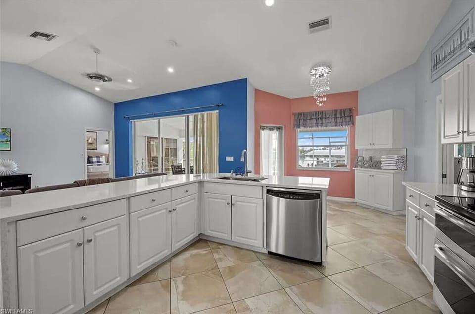 Open Concept Kitchen, with a Cozy Corner Overlooking the Pool and the Lanai