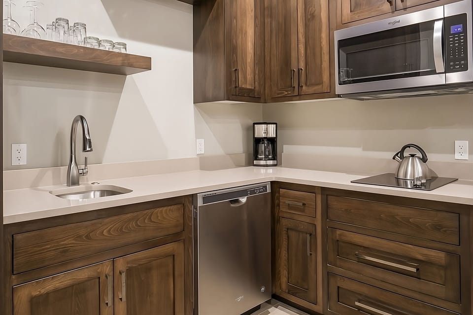 Brew coffee and prep snacks in this modern kitchenette.
