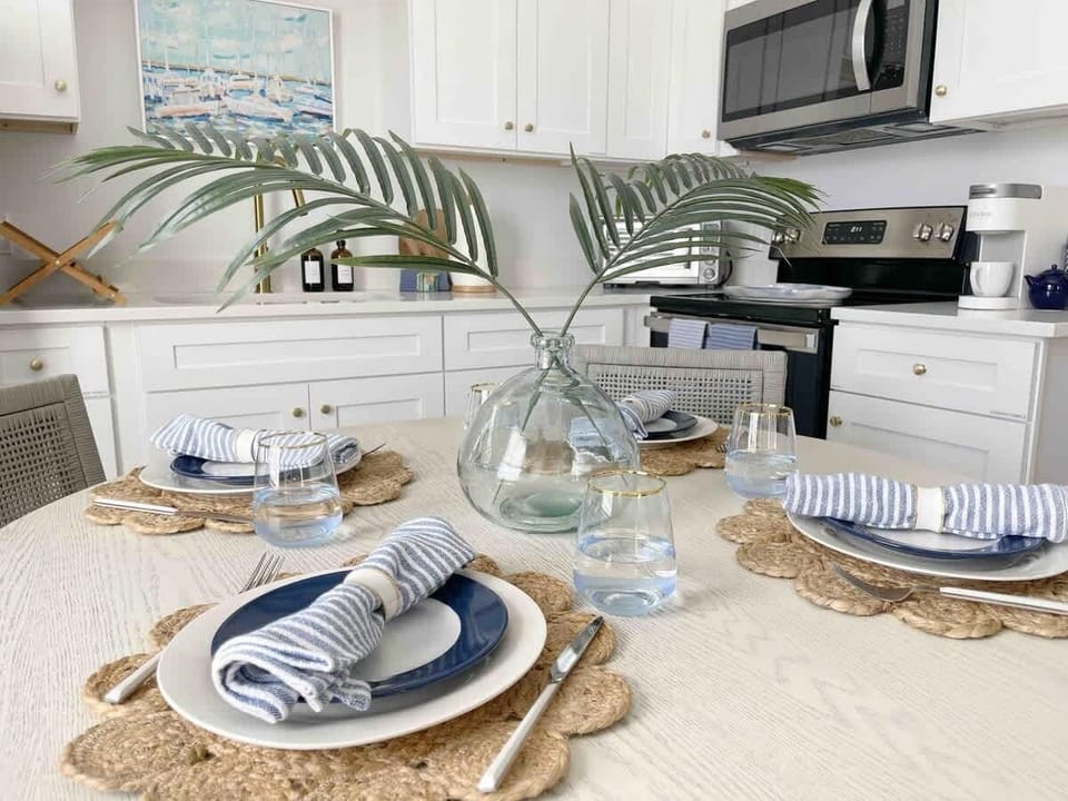 Dinner is Served - A beautifully set dining room table is thoughtfully arranged to make every meal feel special and memorable. 