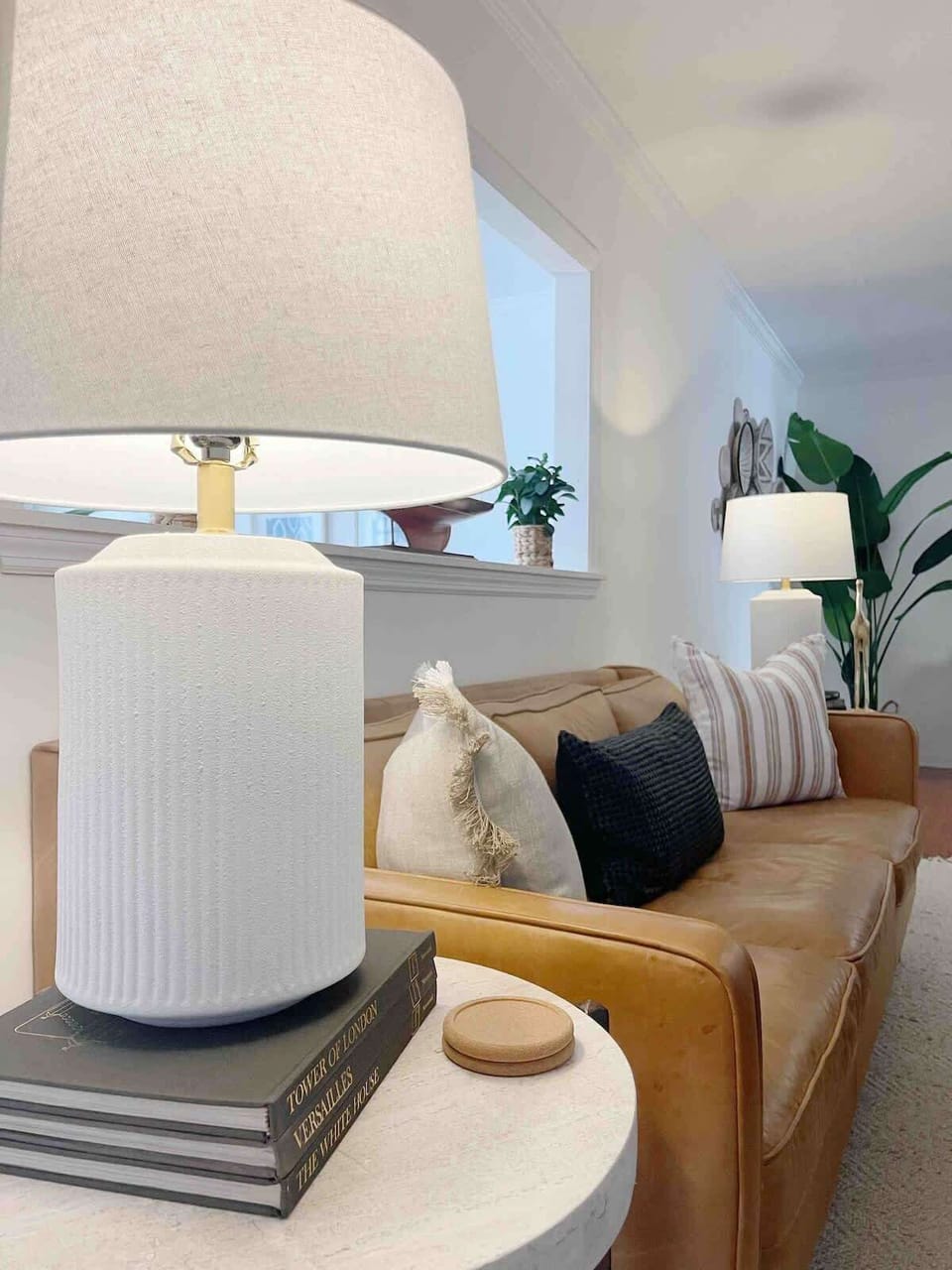 This living room is warm and inviting through carefully curated decor and personal touches. 