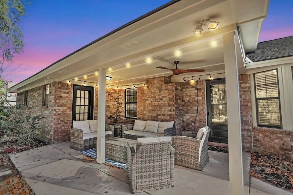 This fun backyard includes a fire pit, hot tub, and enough seating to have a fun, relaxing time with family or friends.