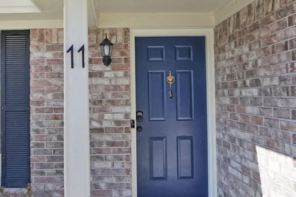 Welcome Home! A cheerful, deep navy front door greets you the moment you arrive. 