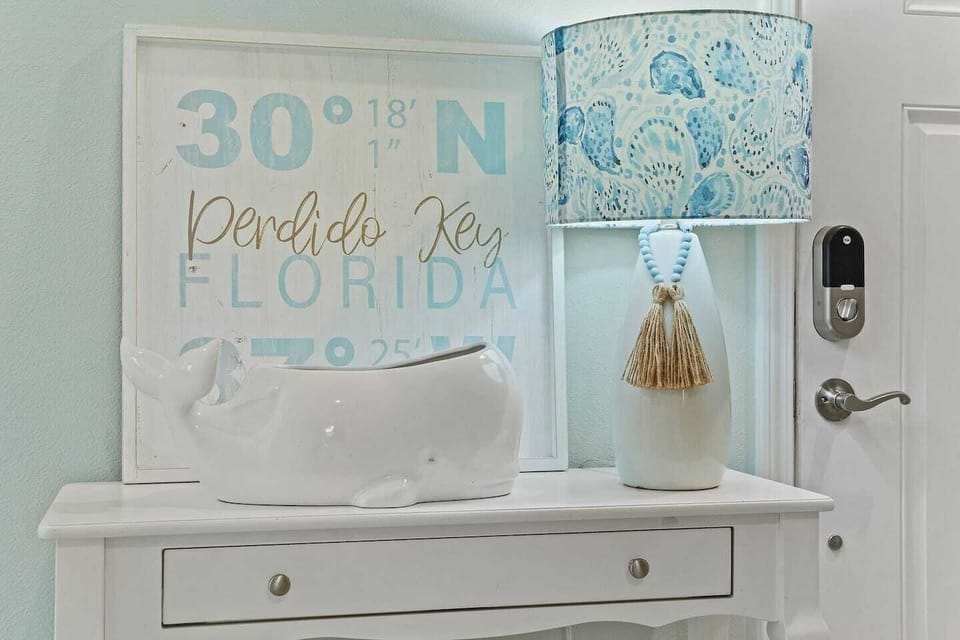 Warm welcoming entryway: decor featuring coastal touches and welcoming vibes for a perfect beach getaway!