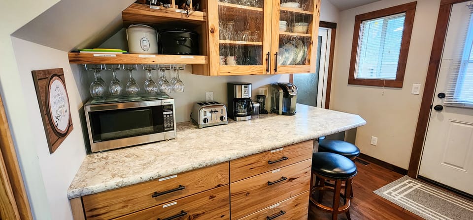 Fully stocked kitchen with microwave, toaster, Drip & Keurig coffee makers. 