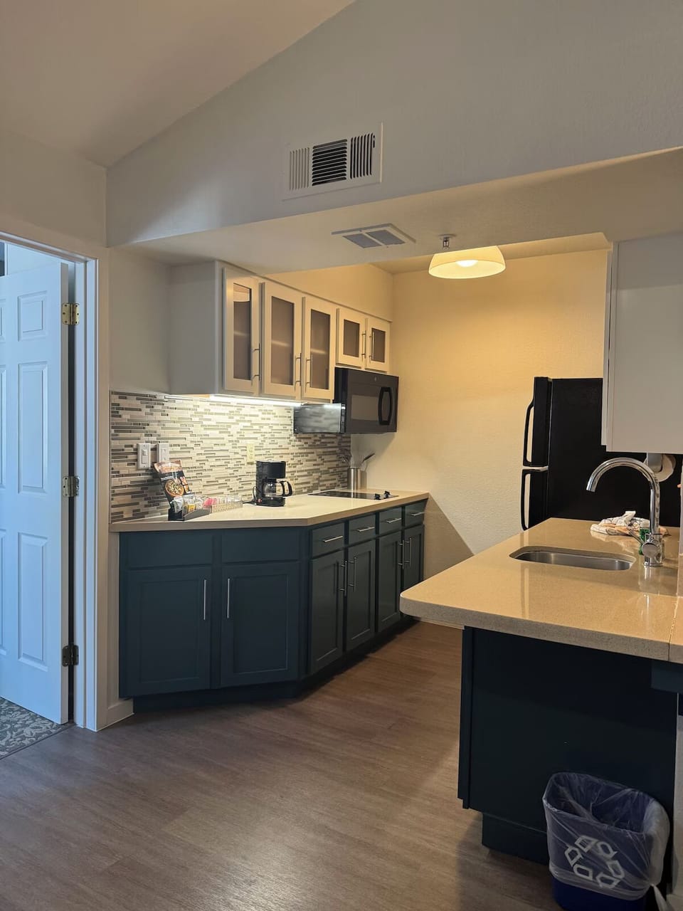 Prepare simple meals in the practical in-room kitchenette.