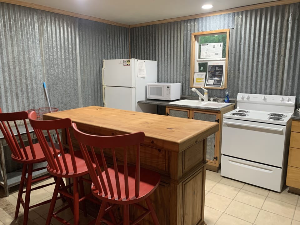 full kitchen with fun bar to hang out at