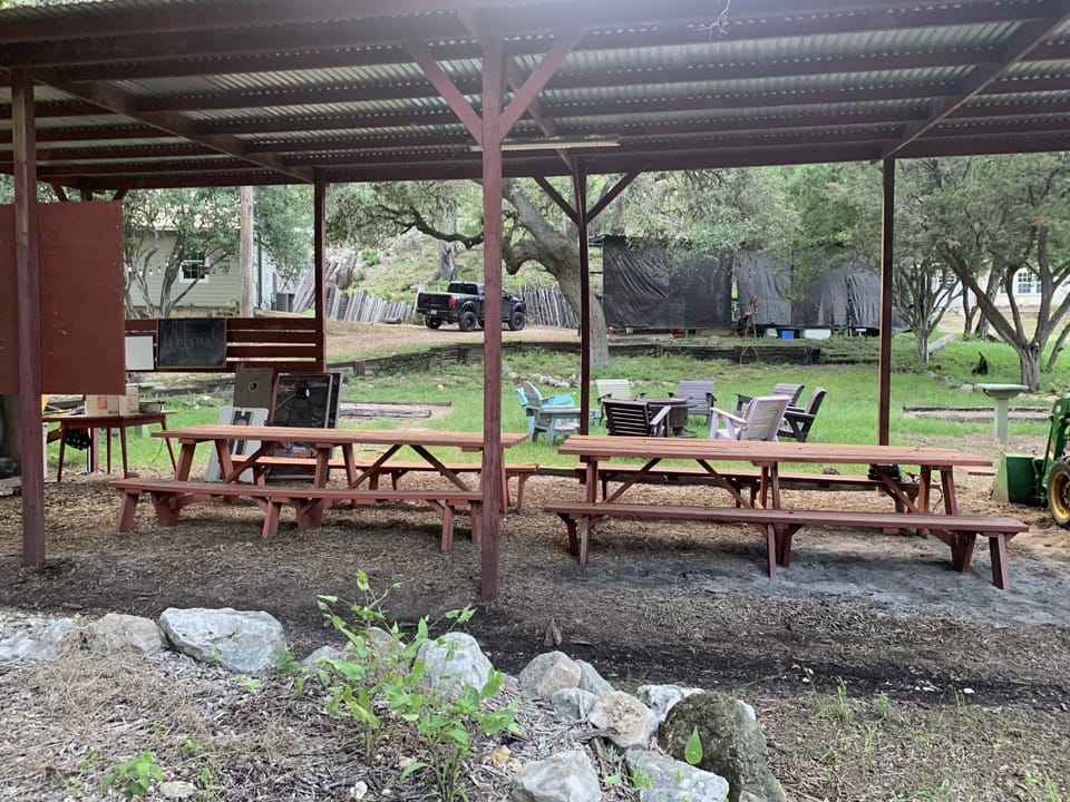 Huge outdoor gathering/picnic area with grill, horseshoes and cornhole games