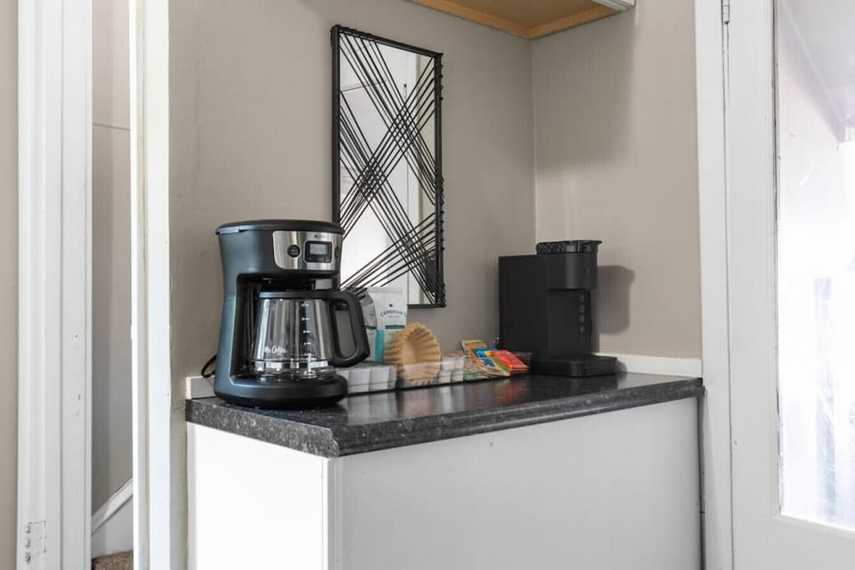 Coffee bar includes all the essentials for your morning brew including a 12-cup coffee maker, Keurig, and a starter pack of ground coffee, tea, K-cups, sweeteners, and creamer!