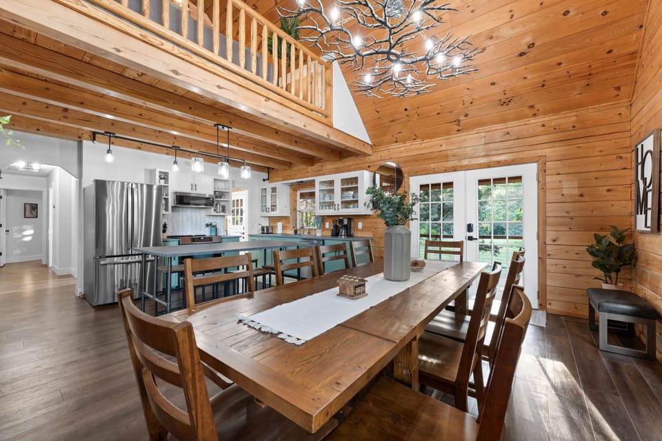 Our open-concept dining room and kitchen, with seating at the dining table for 10. The kitchen island has seating for an additional 6 people.