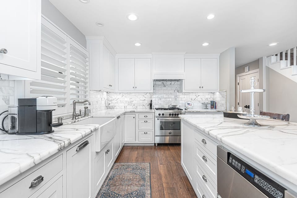 The kitchen comes stocked with dishes, utensils, cookware, bakeware, and all major appliances.
                
