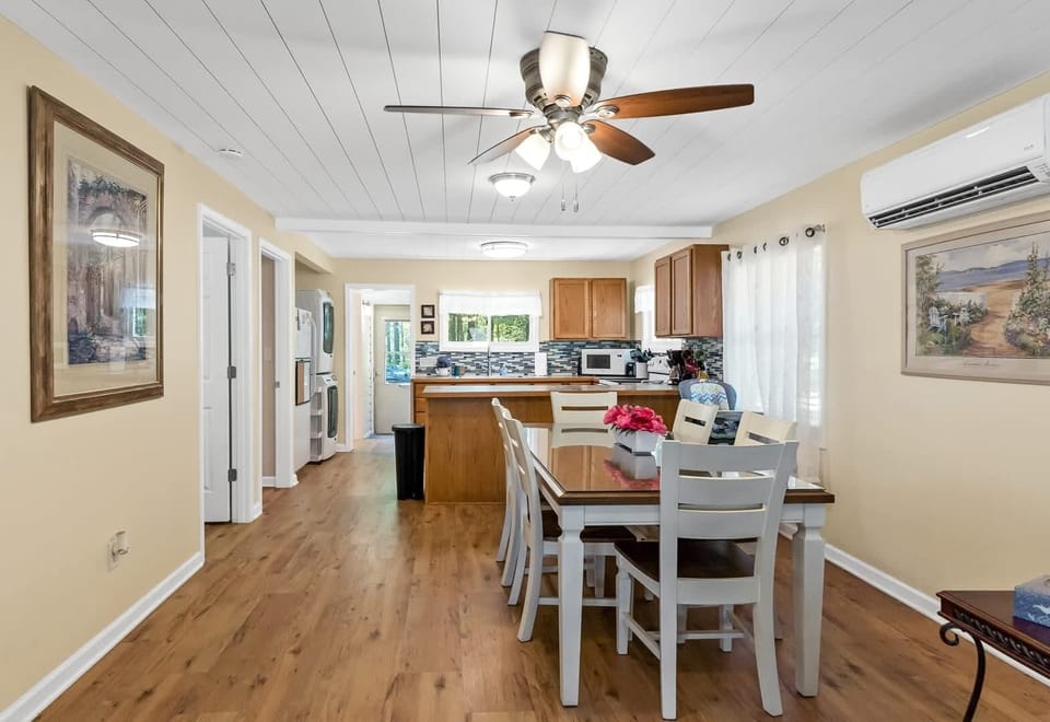 View of Morningside Vista's dining room & kitchen areas from the lakeside door that exits to the deck