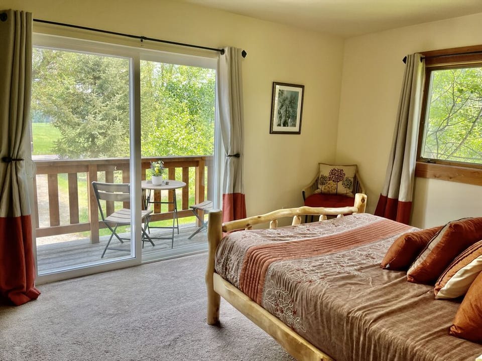 Balcony off of bedroom with views towards pastures and mountains.