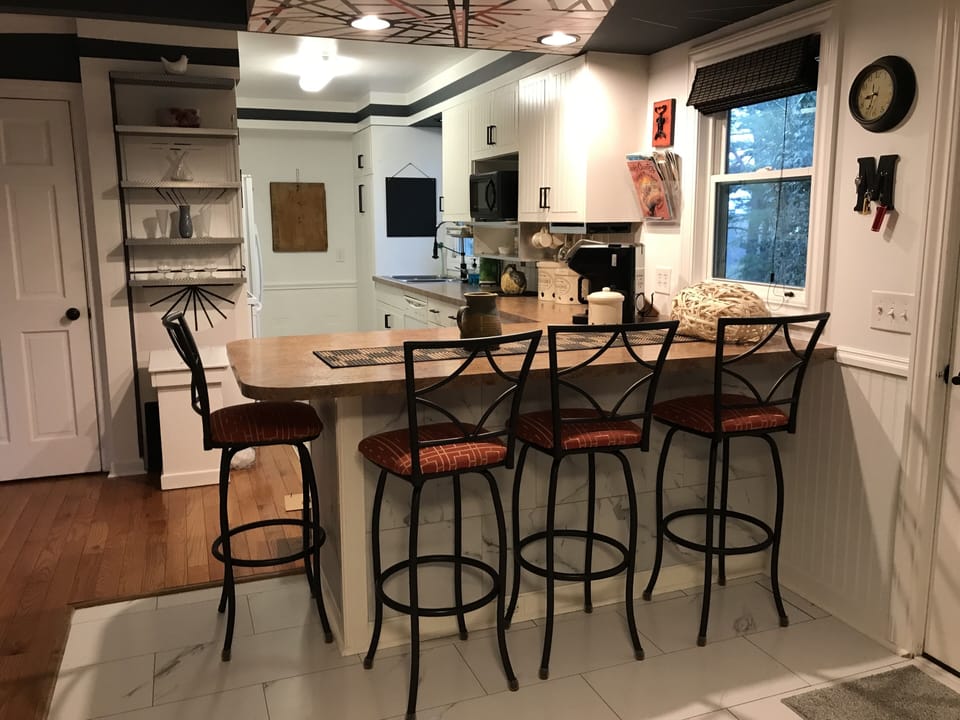 Eat-in kitchen, full size appliances, all your plates, flatware and more.