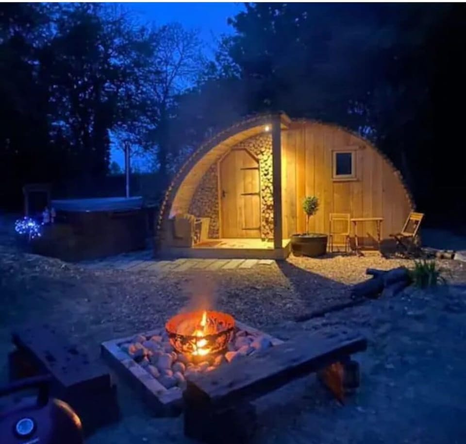 Fox Lodge at night with fire pit