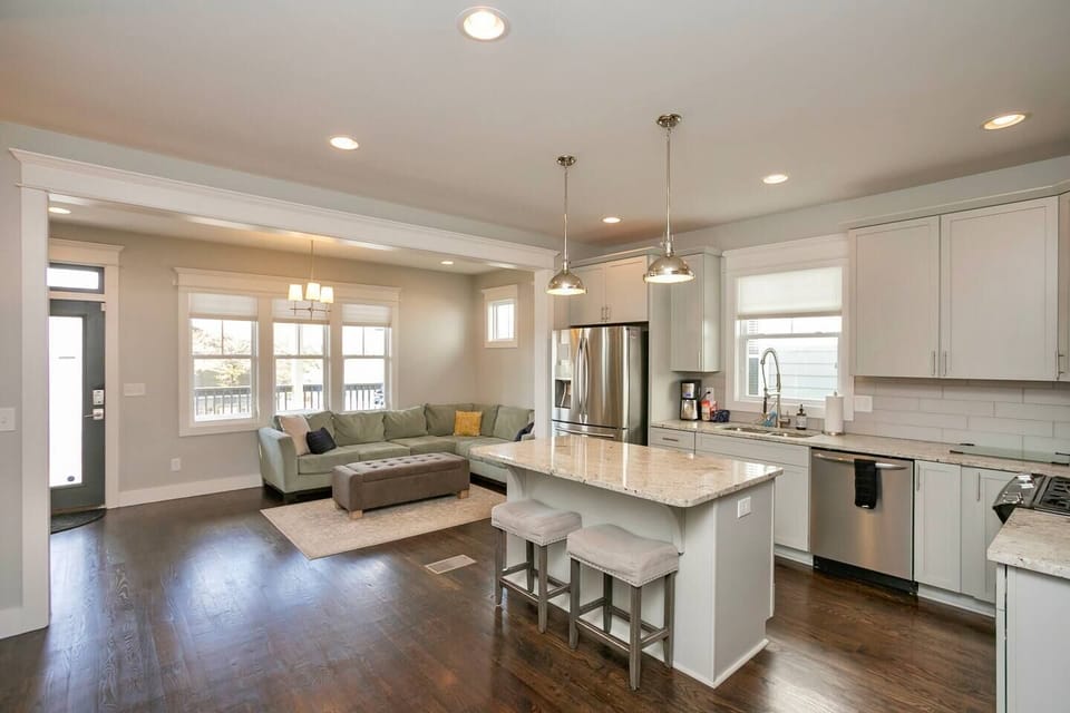 Kitchen opens up to 2nd living space with access to the back deck and backyard.