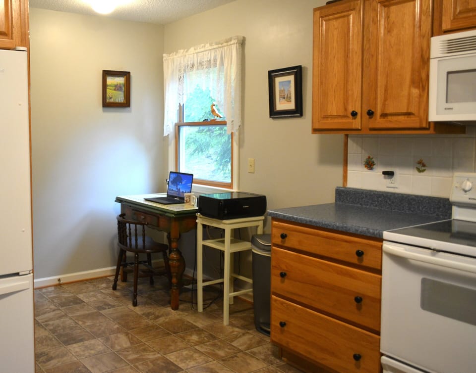 Work station off kitchen with printer.  