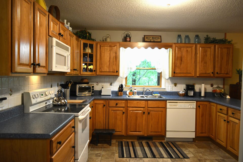 Large kitchen for preparing your own meals in house.  