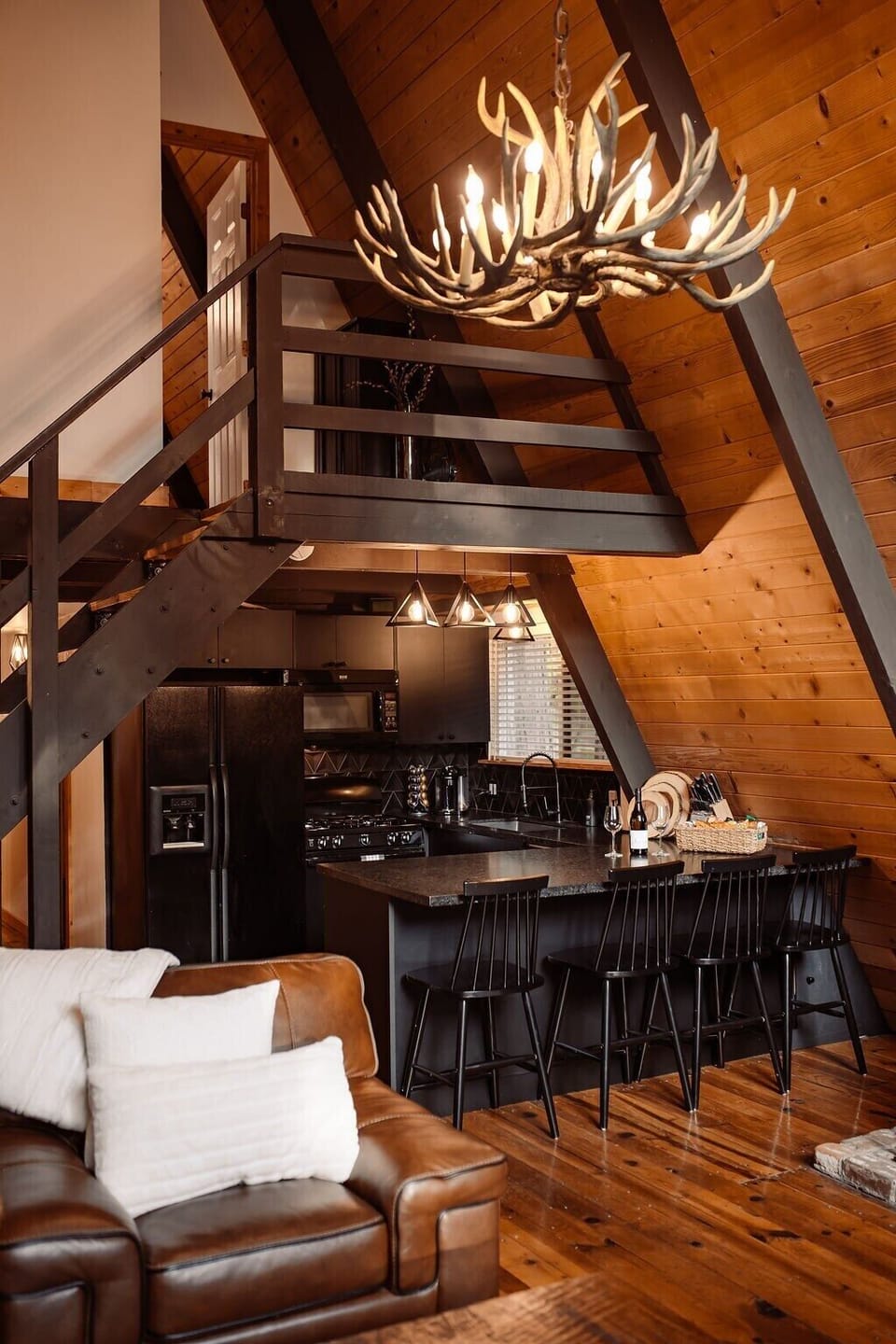 Kitchen, bar, and upstairs interior balcony