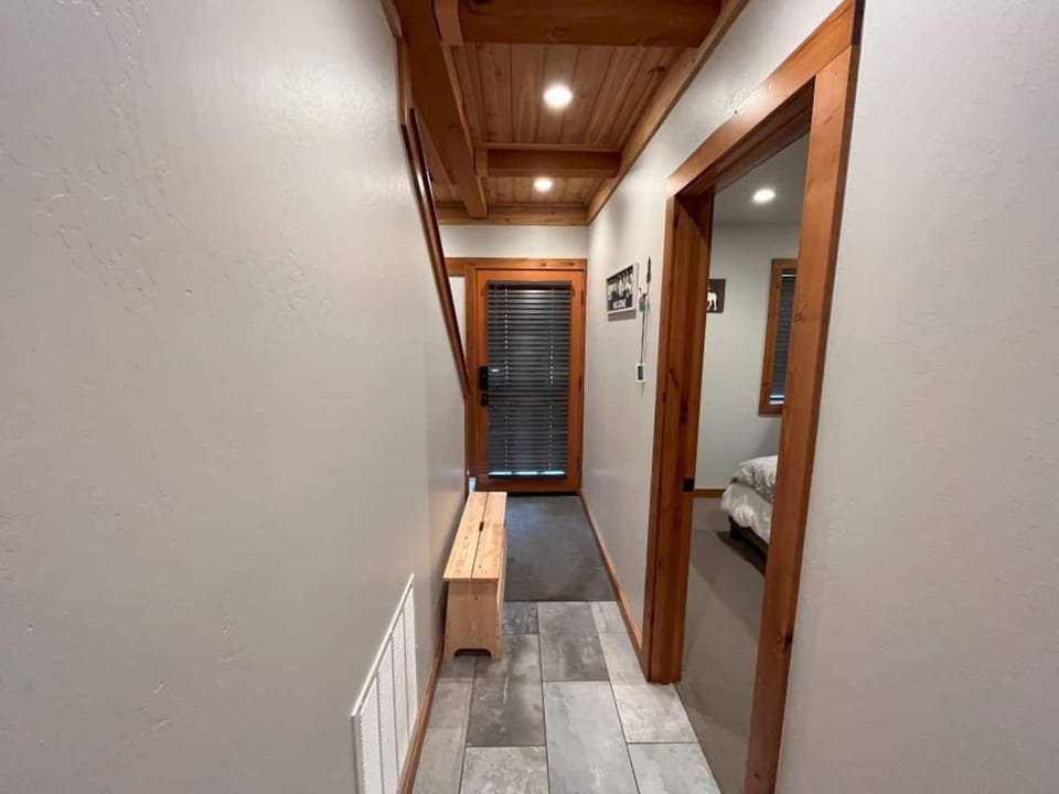 Downstairs hallway leading to the front door.