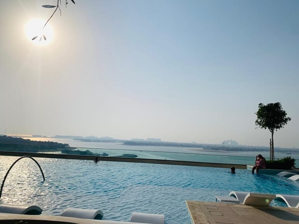 The Pool With Sunlounges