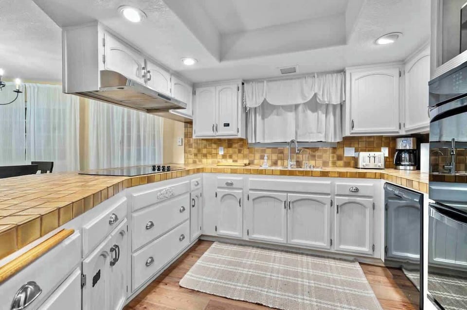 A fully stocked kitchen featuring top-of-the-line built-in appliances, generous cabinetry, and a well-lit space that makes cooking a pleasure. It’s the perfect setting for culinary creativity and effortless meal prep.