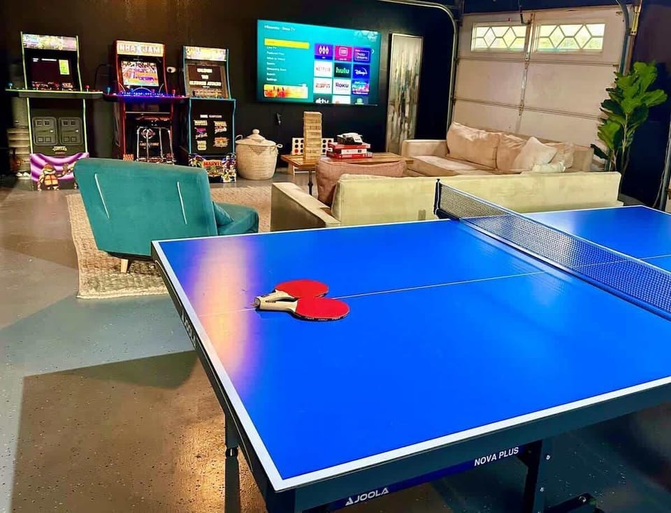 Whether you're up for a competitive ping pong match, a nostalgic trip down memory lane with retro arcade games, or simply relaxing on the cozy couches with a big-screen binge session, this space has something for everyone to enjoy. Game on!