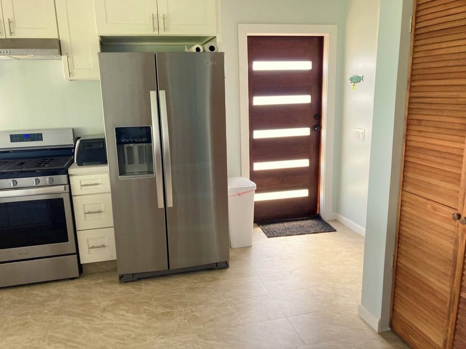 Kitchen has stainless steel appliances with everything you'll need for your stay