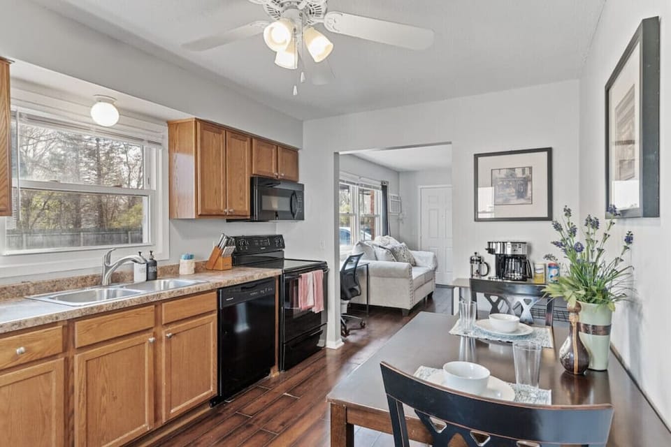 Kitchen View 2 - Everything you need to cook (pots, pans, etc.), dine (plates, cutlery, glasses, etc.) and clean.