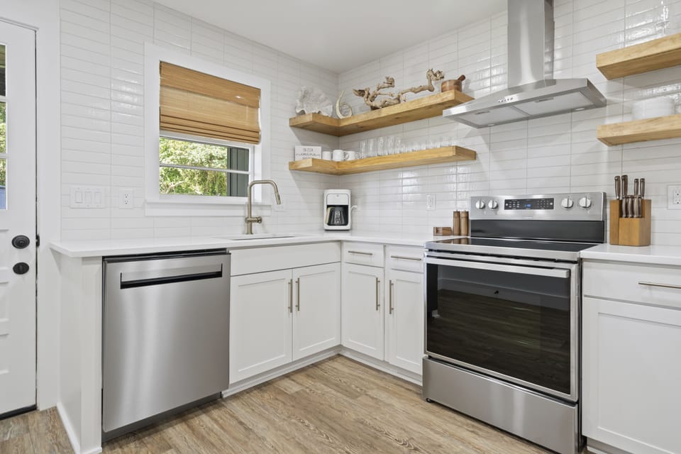 Kitchen with door to back patio and yard