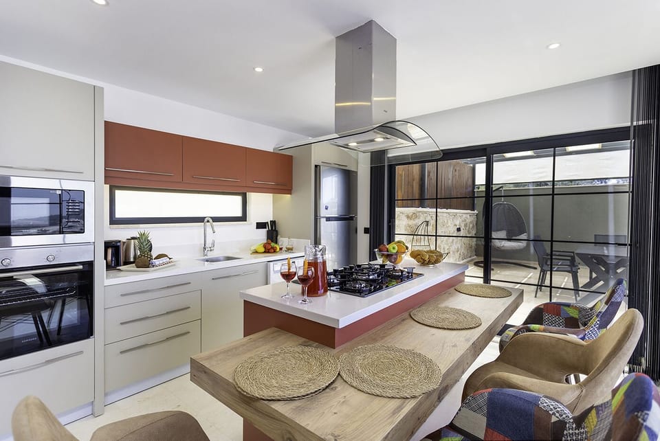 Open plan fully fitted kitchen with an island unit