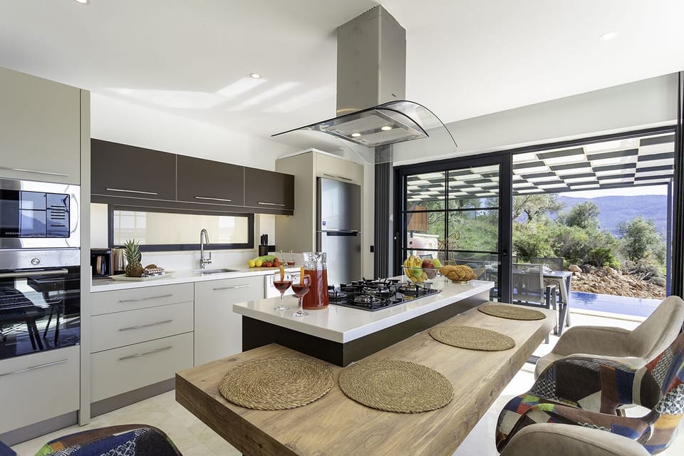 Open plan fully fitted kitchen with an island unit