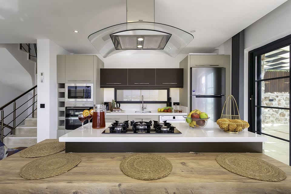 Open plan fully fitted kitchen with an island unit