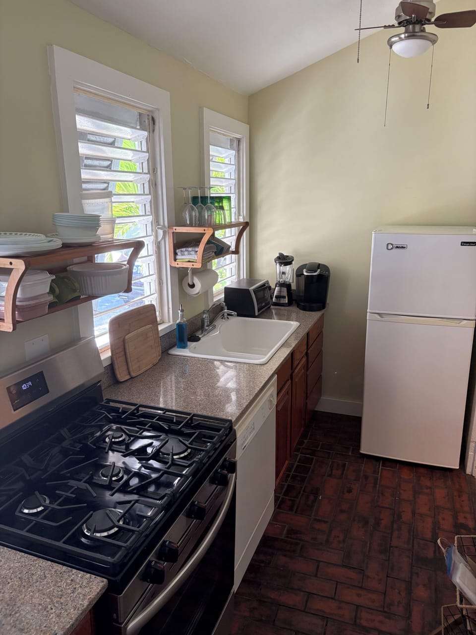 Full kitchen with stove, dishwasher, microwave, and fridge