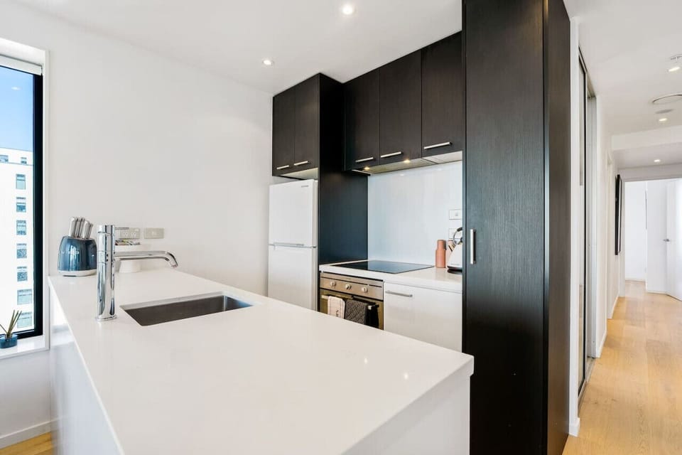 The kitchen has a fridge/freezer, oven, cook top, rangehood and microwave.