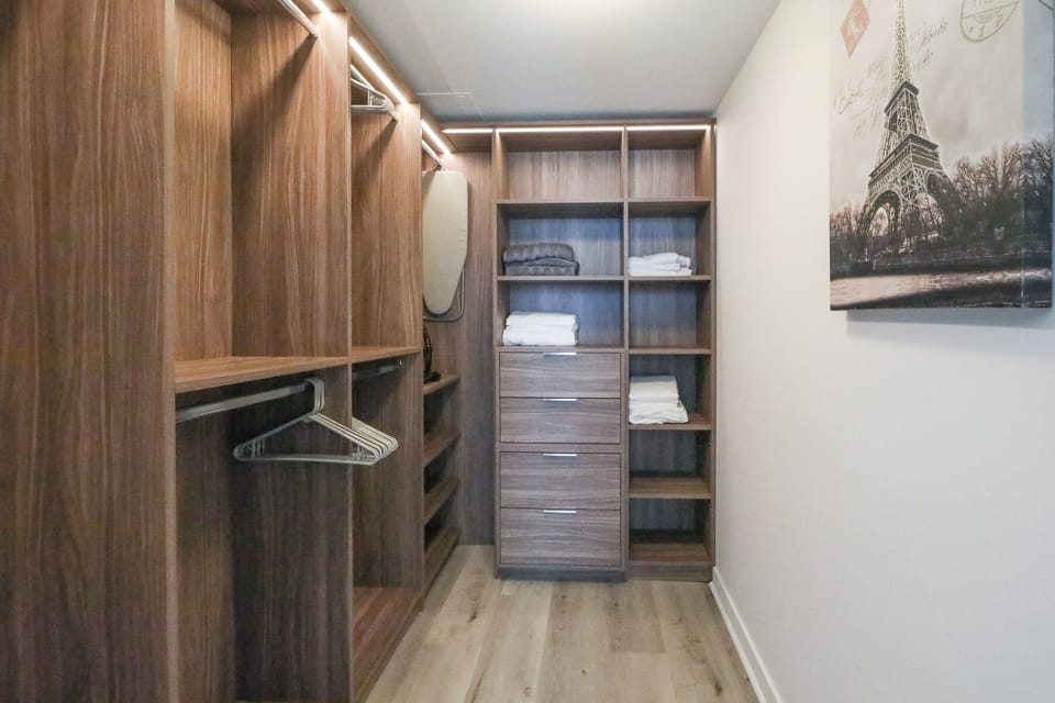 Modern and Spacious Walk in Closet with LED Lighting