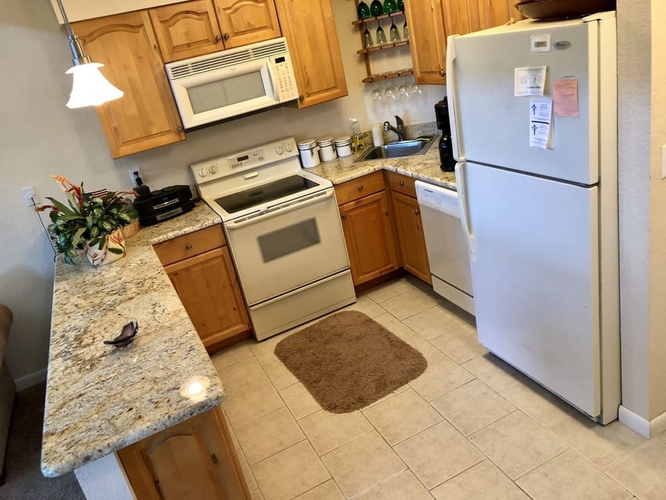 Kitchen is fully stocked for any meal.  Full size fridge and granite countertops