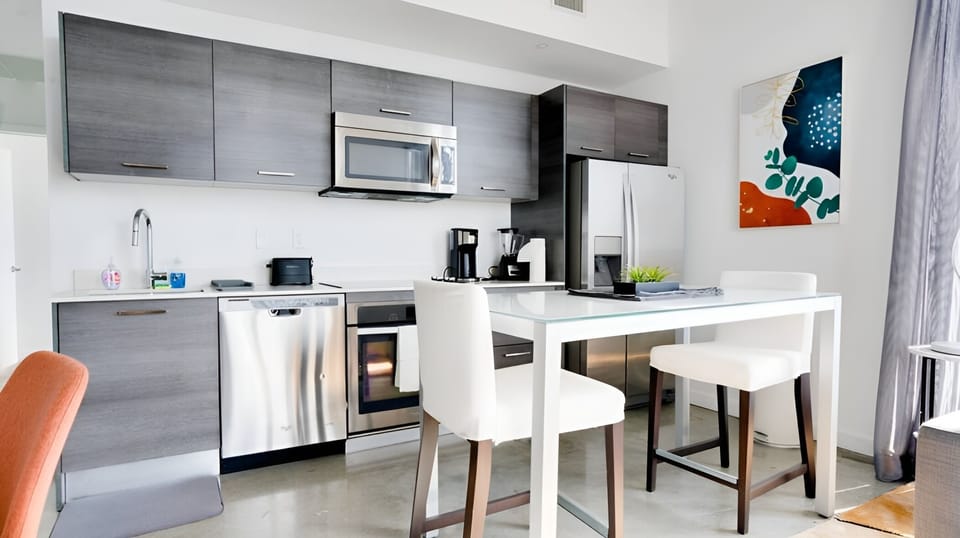 Fully equipped kitchen with quality appliances and complete set of cookware