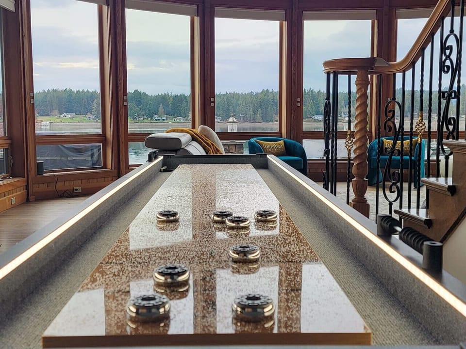 Pick up a game of shuffleboard in the main house with the breathtaking views of water as your backdrop