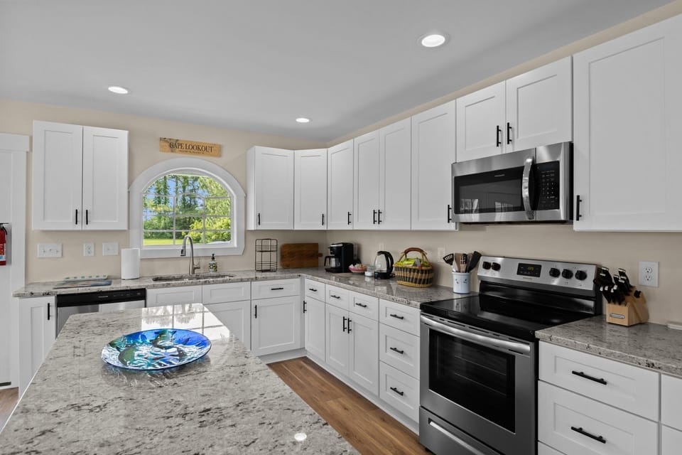 The kitchen features ample countertop space for you. 