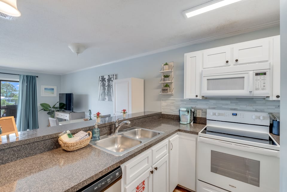 The kitchen shares the same open space with the dining and living areas.
