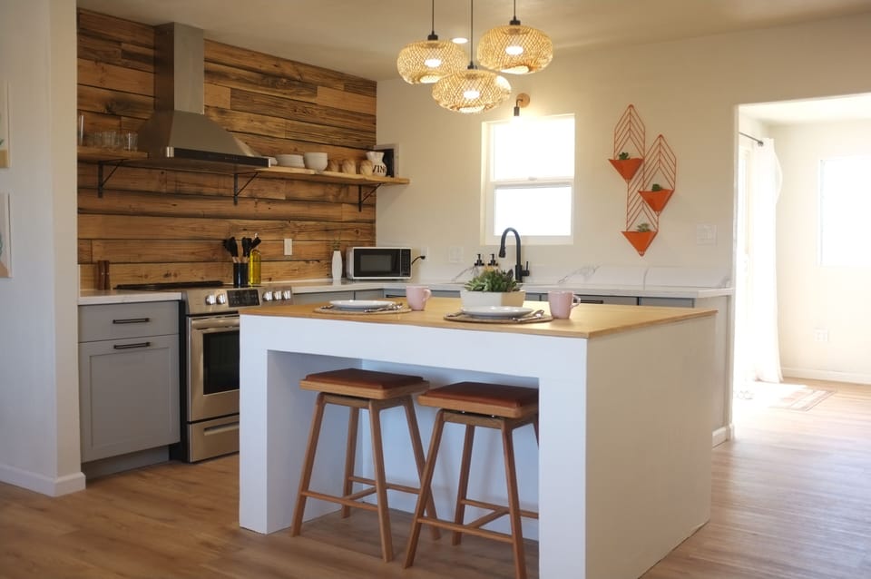 Large and stocked kitchen with huge island for meal prep and conversation