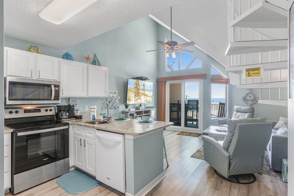 Step into the lofted main living space with stunning full Gulf views.